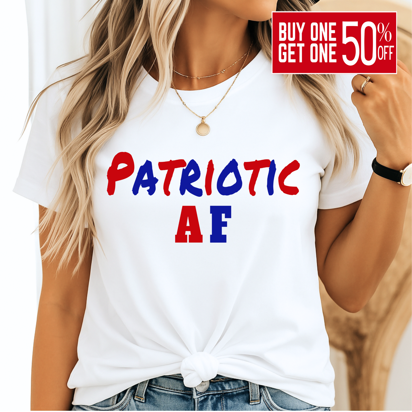 Woman wearing white “Patriotic AF” tee with red and blue lettering, styled with a knot