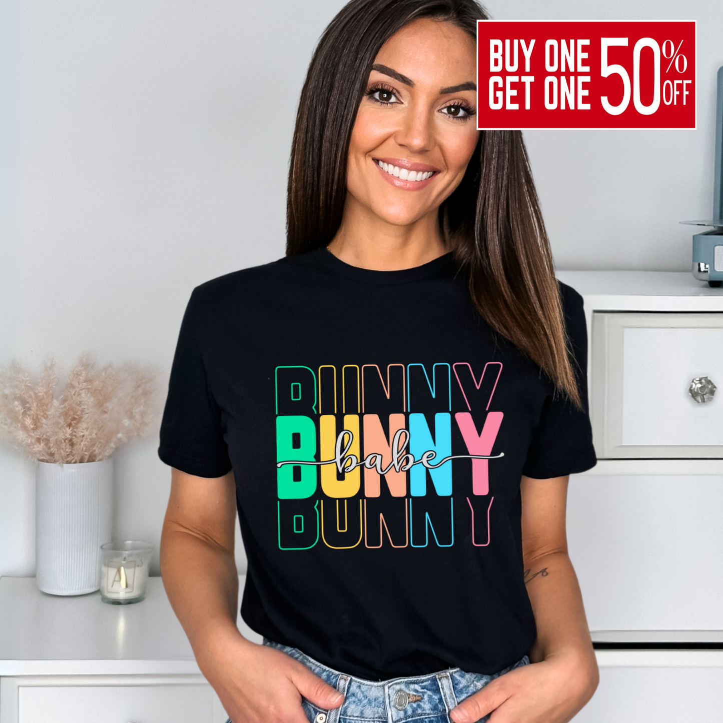 Trendy Bunny Babe graphic t-shirt with colorful pastel typography, perfect for Easter outfits, spring fashion, and casual wear. Soft cotton tee for women.