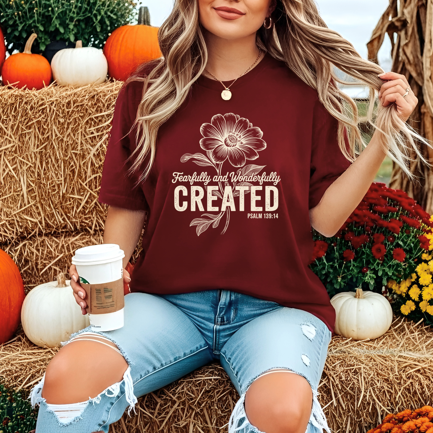 Woman wearing a Christian floral t-shirt featuring encouraging scripture design