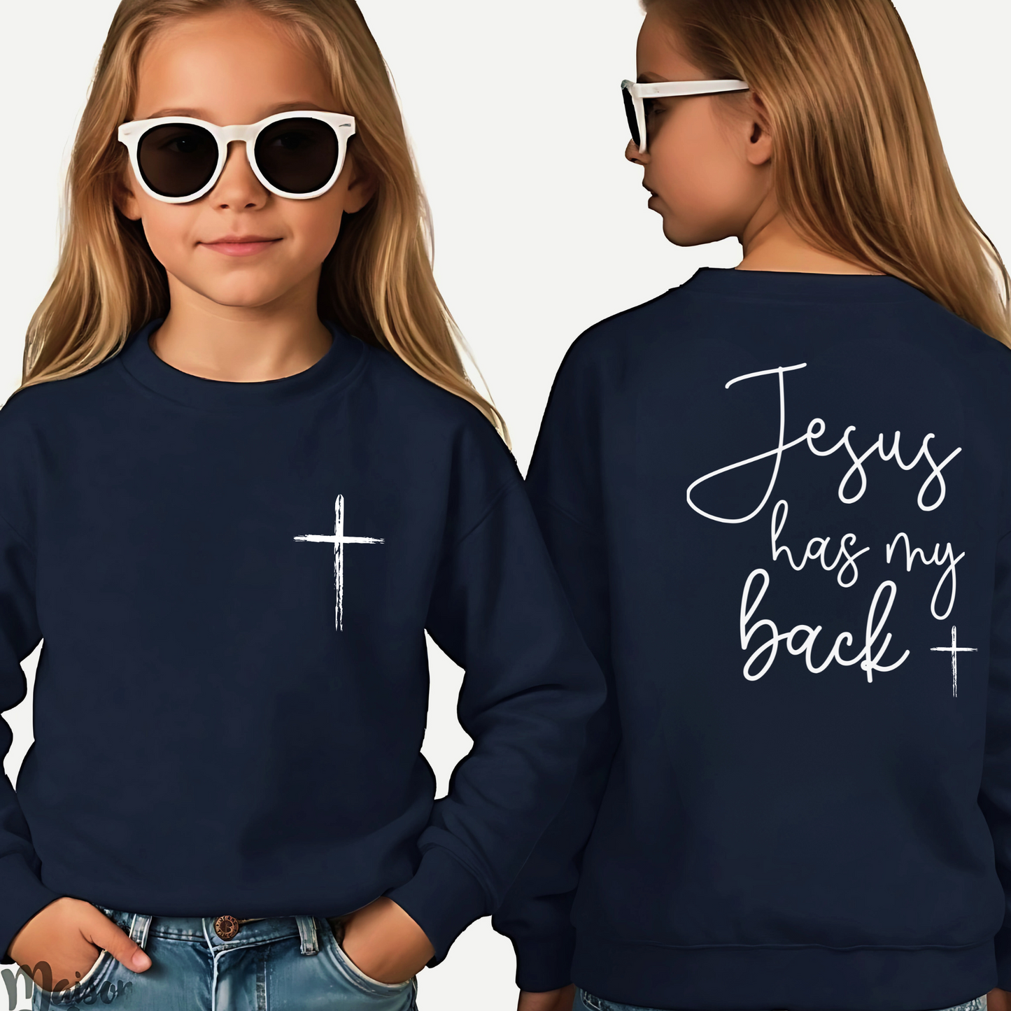 Young girl wearing a navy blue 'Jesus Has My Back' youth sweatshirt with a cross design, faith-based Christian apparel for kids