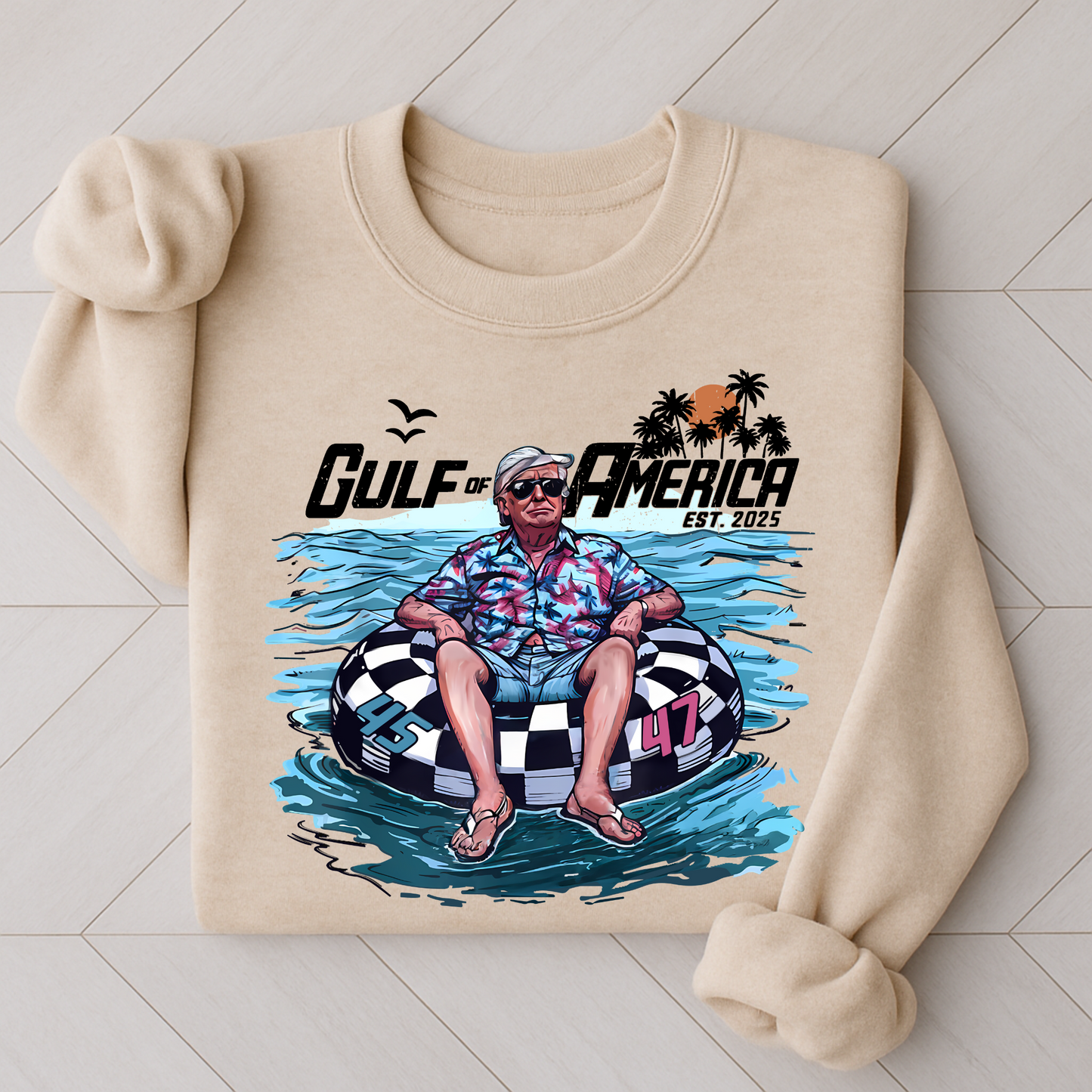 Sand color Gulf of America sweatshirt – Trump floating in pool tube graphic