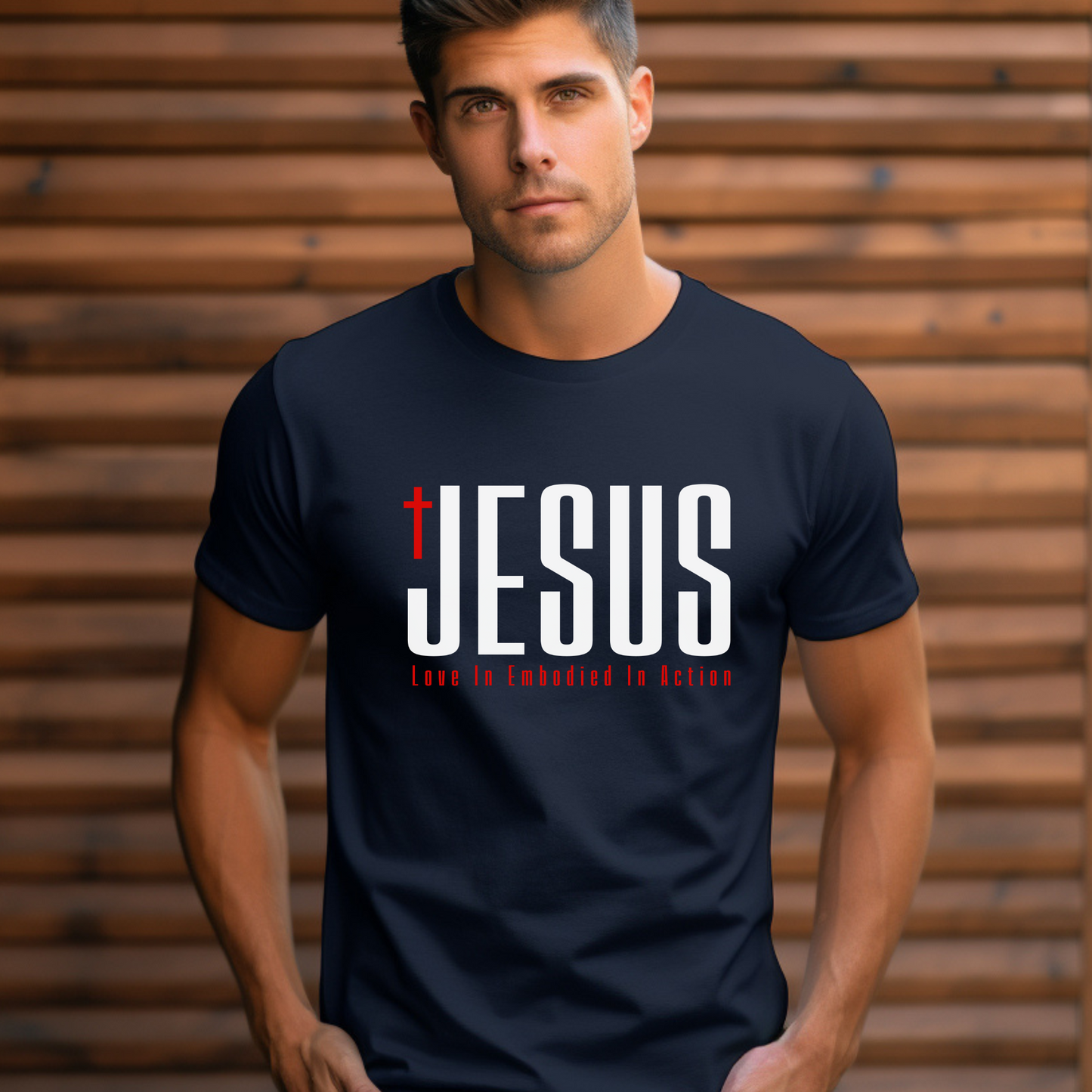 Man wearing a black t-shirt with 'JESUS' printed on it against a wooden background