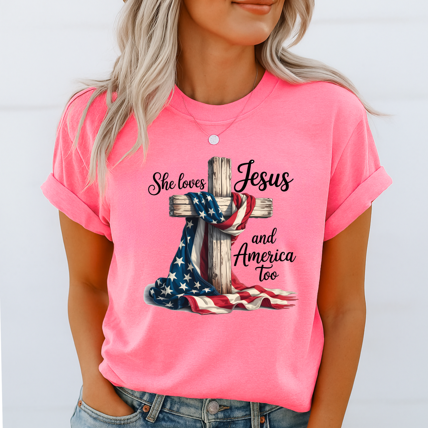 Woman in pink patriotic Christian tee with flag and cross design