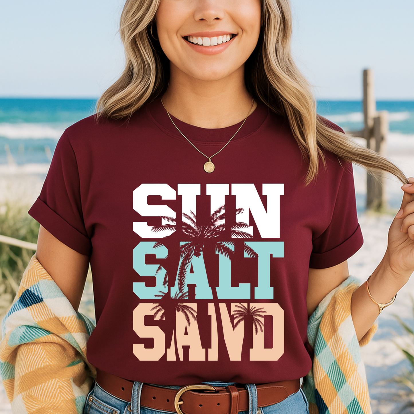 Maroon shirt with palm tree print worn on the beach