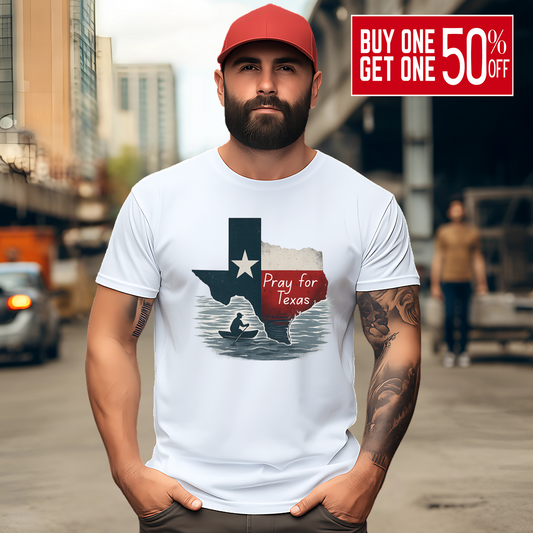 White Pray for Texas T-shirt in a unisex fit, styled for men with a red Texas cap. Features distressed Texas flag artwork with canoe silhouette for a bold, supportive look.