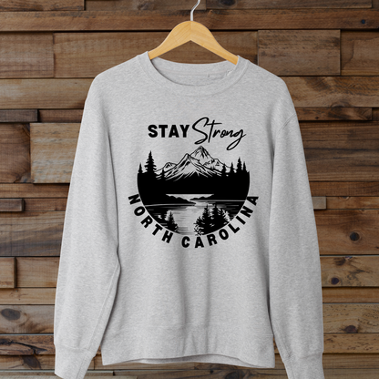 Show your support for those affected by Hurricane Helene in Western North Carolina with this custom "North Carolina Stay Strong" design. The majority of proceeds from these sales will be donated directly to families affected. 