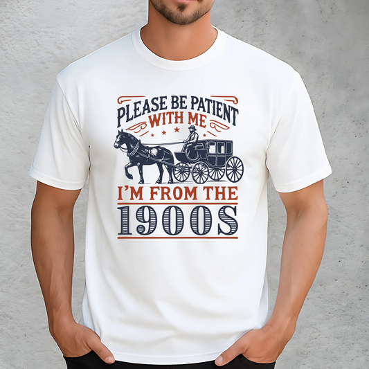 Male model wearing white T-shirt with Please Be Patient With Me I’m From the 1900s horse and carriage design – funny nostalgic unisex cotton tee for men