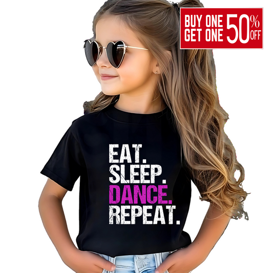 Child wearing a black t-shirt with 'EAT. SLEEP. DANCE. REPEAT.' text.