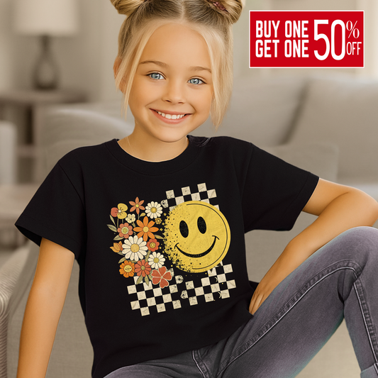 Youth girl wearing fall smiley face t-shirt with floral and checkerboard design
