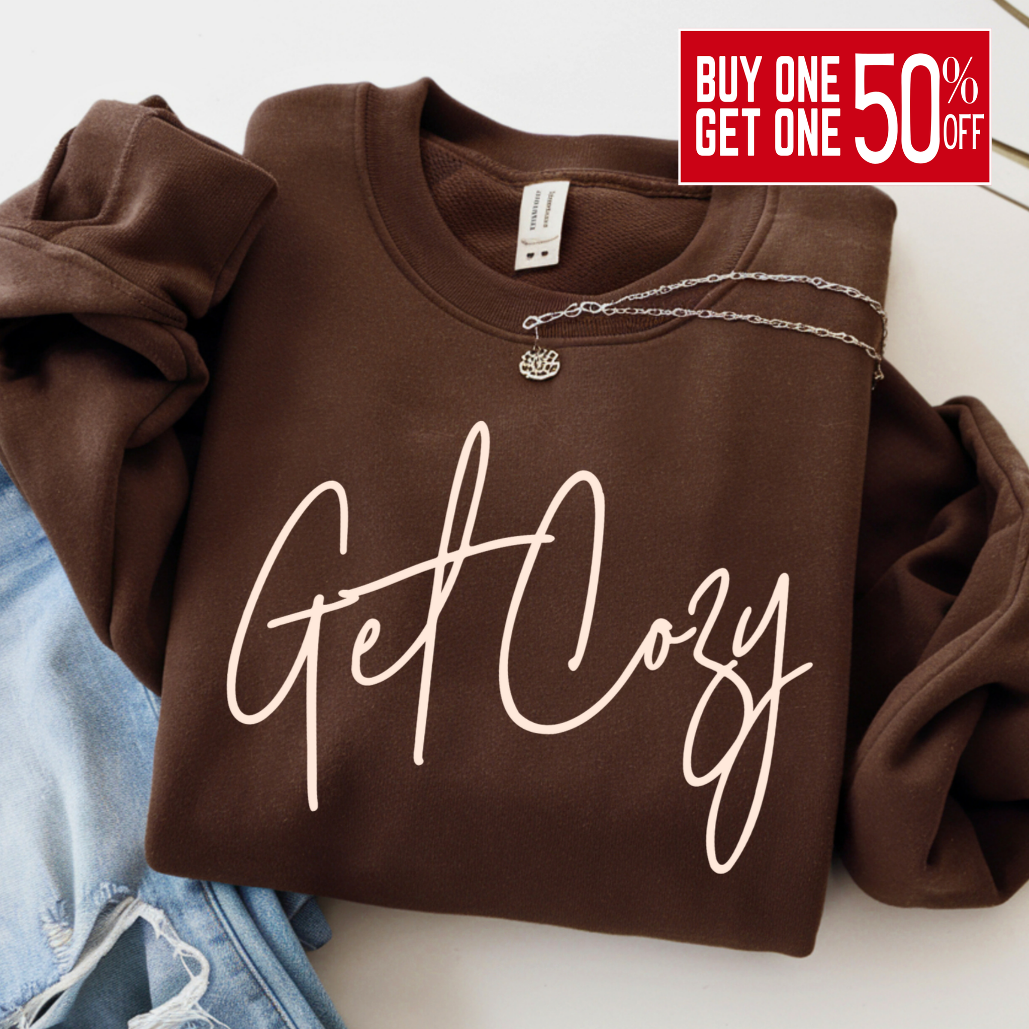 Brown sweatshirt with 'Get Cozy' text on a white background