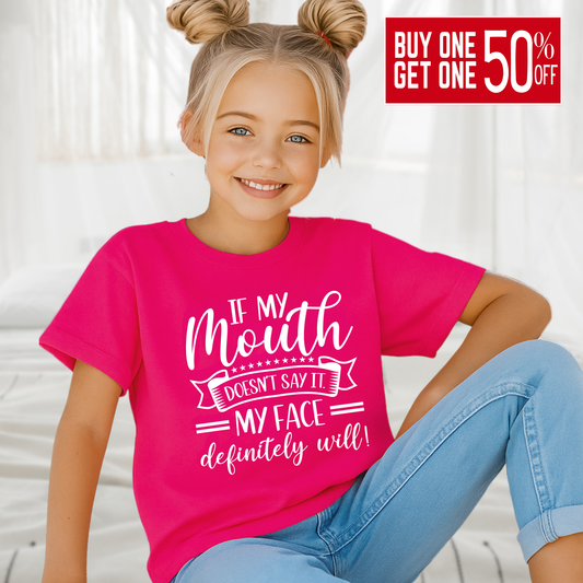Girl in dark pink t-shirt with playful expression and quote
