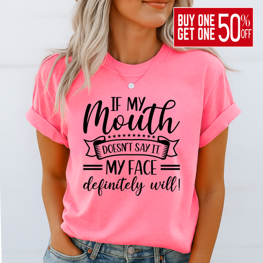 Bright pink graphic shirt on woman with hand in pocket