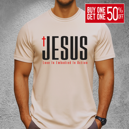 Men’s sand-colored Christian JESUS T-shirt with cross and “Love In Embodied In Action” – unisex religious shirt S–3X, tall sizes available in select colors.