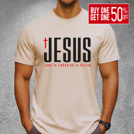 Men’s sand-colored Christian JESUS T-shirt with cross and “Love In Embodied In Action” – unisex religious shirt S–3X, tall sizes available in select colors.