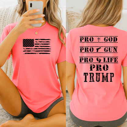 Person wearing Safety Pink T-shirt with distressed USA flag on front and bold statement text on back.