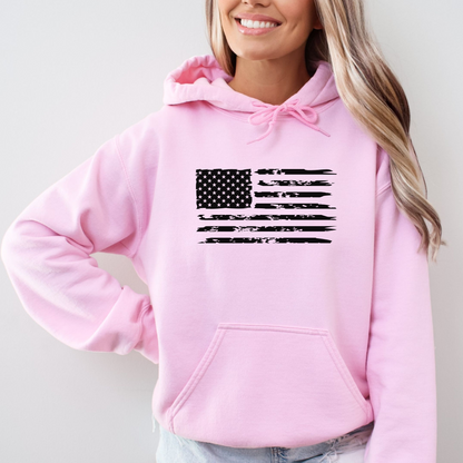Person wearing Light Pink hoodie with distressed USA flag front and bold statement back print design.