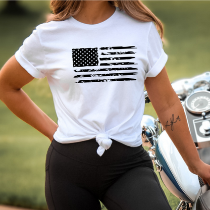 Person wearing White T-shirt with distressed USA flag on front and bold statement text on back.