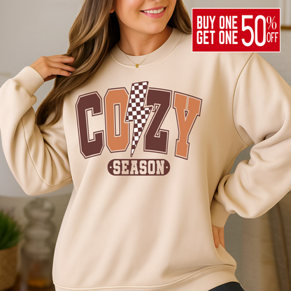 Sand colored Cozy Season sweatshirt styled for autumn indoors