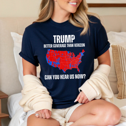 Woman sitting on bed in navy Trump graphic tee with cardigan