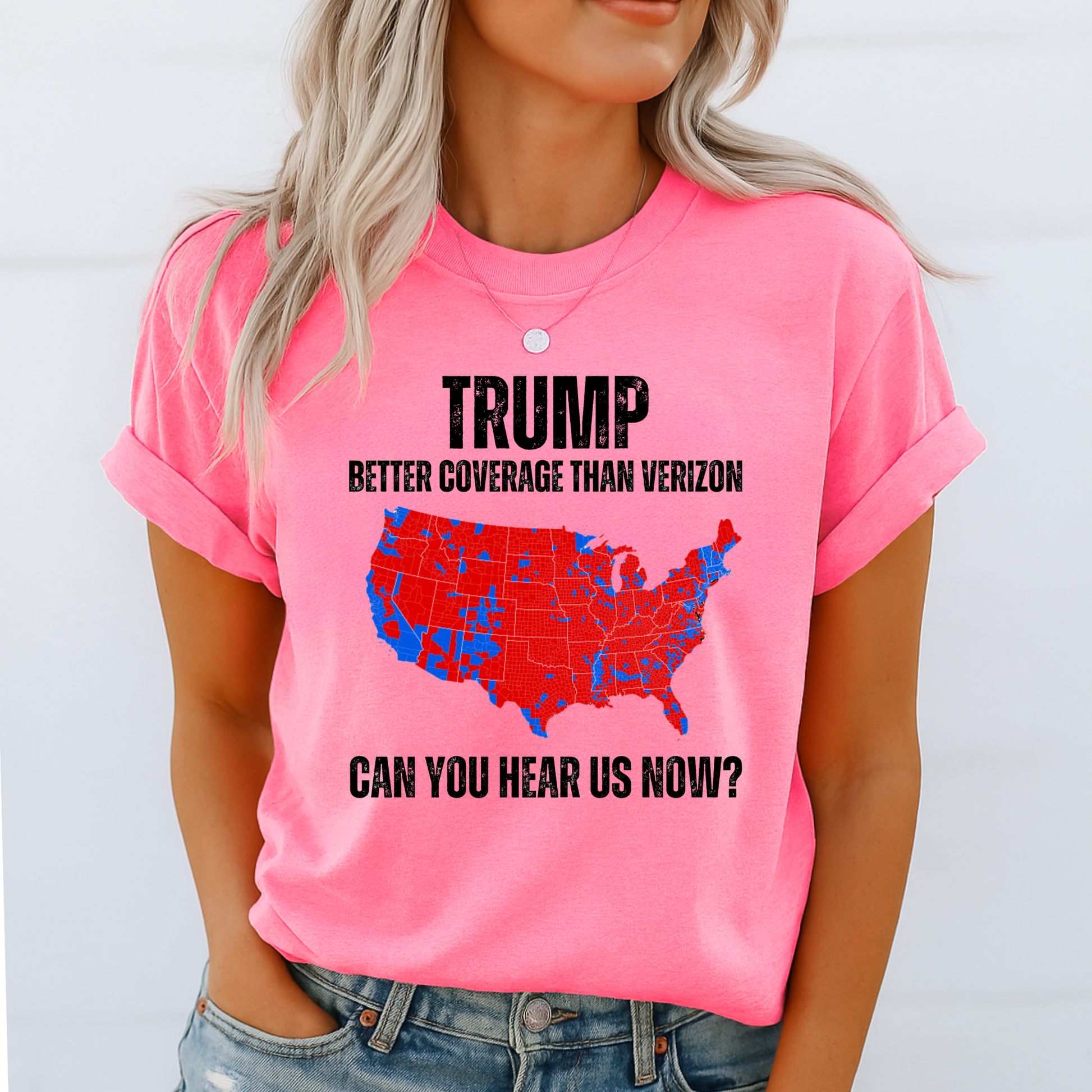 Woman in hot pink MAGA coverage shirt smiling casually