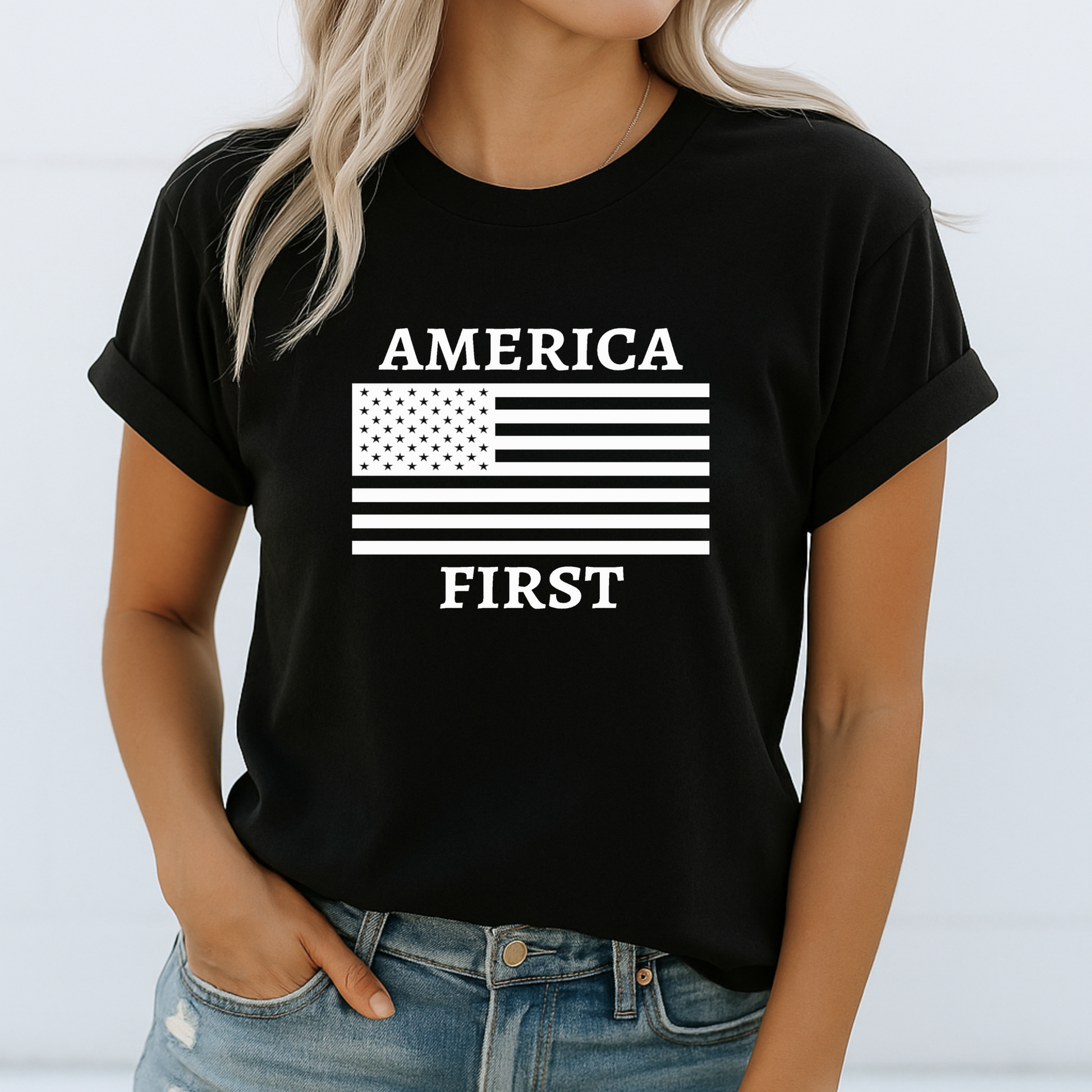 Woman in black tee featuring bold white “America First” patriotic graphic