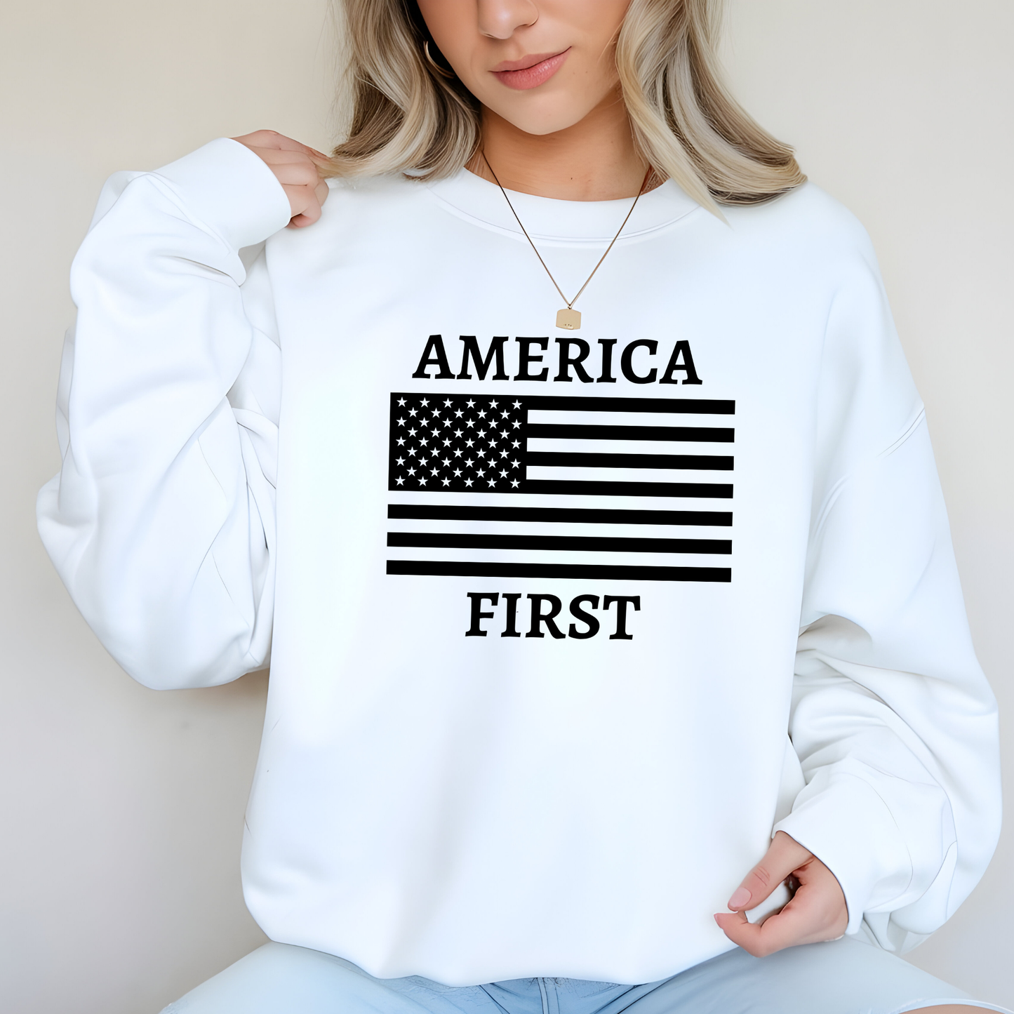 Woman in white sweatshirt with America First flag design

