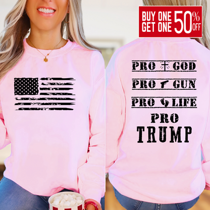 Woman wearing Pink sweatshirt with distressed USA flag and bold statement back print design.