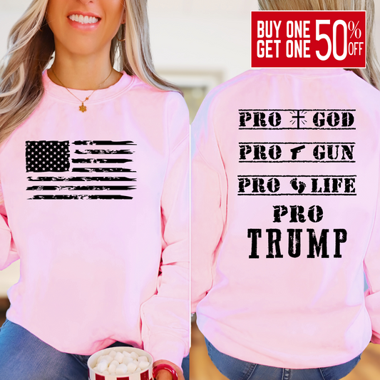 Woman wearing Pink sweatshirt with distressed USA flag and bold statement back print design.