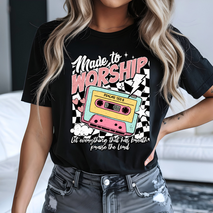 Woman wearing black retro worship shirt with pastel cassette graphic