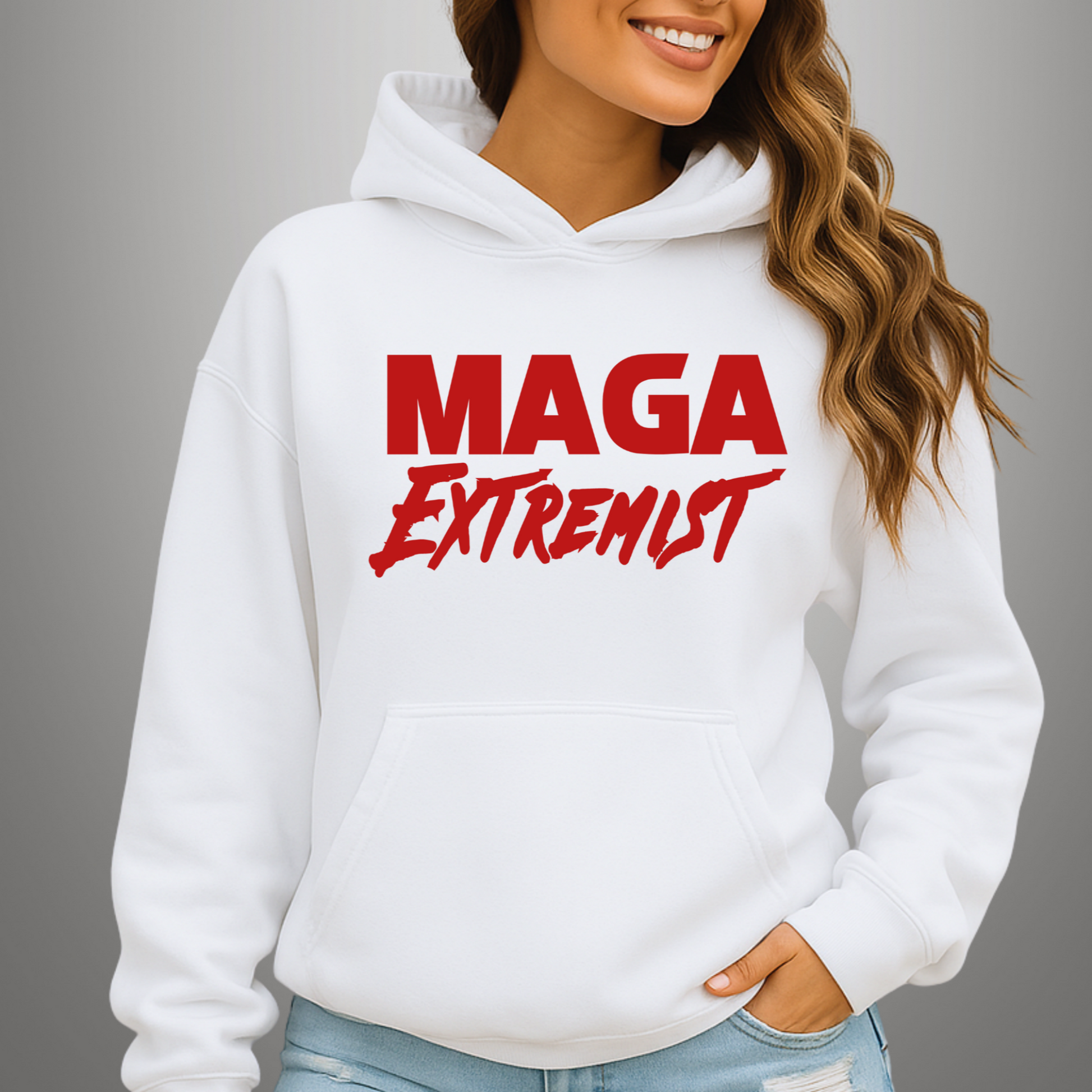 Woman wearing white MAGA Extremist hoodie smiling confidently