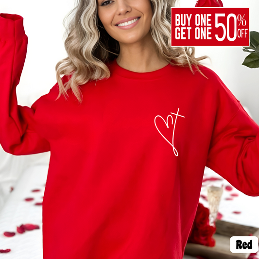 Woman wearing a red sweatshirt with minimalist heart and cross chest design, Valentine's Day outfit