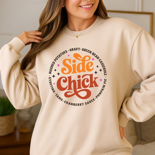 Light sand “Side Chick” sweatshirt worn indoors. Perfect retro Thanksgiving design with cozy unisex fit. Funny fall pullover for Friendsgiving, holiday parties, or foodie fashion. Styled for autumn with cute seasonal colors.